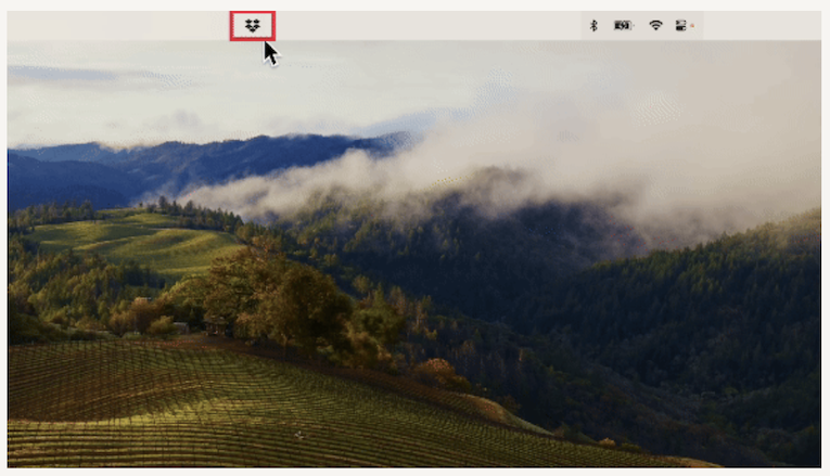 Gambar menunjukkan ikon Dropbox yang ditampilkan di desktop Mac.